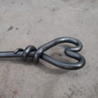 Heart fire poker with log hook