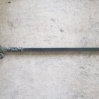 Reverse twist fire poker